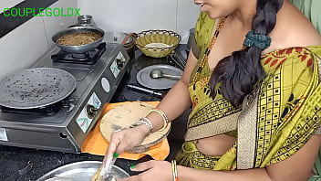 Two women cooking up a double delight in the kitchen